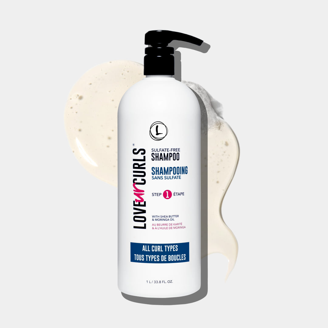 Love Ur Curls shampoo bottle with pump on a light gray background
